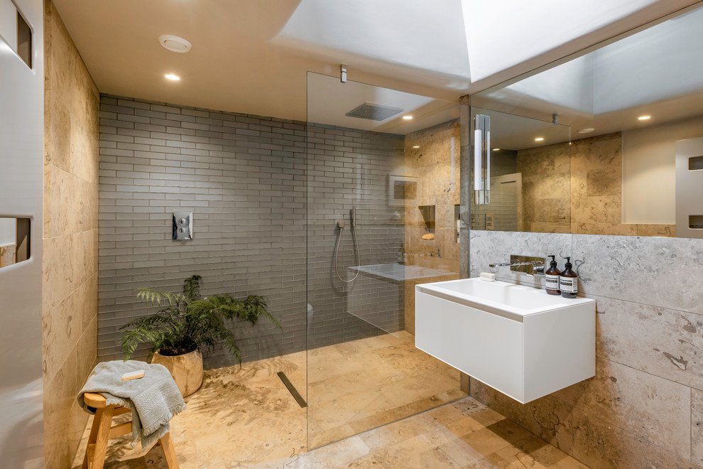 Design ideas for a contemporary 3/4 bathroom in Other with flat-panel cabinets, white cabinets, a curbless shower, beige tile, gray tile, an integrated sink, beige floor, an open shower and white benchtops.