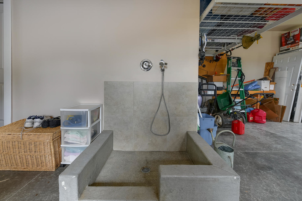 Example of a large attached garage design in Portland