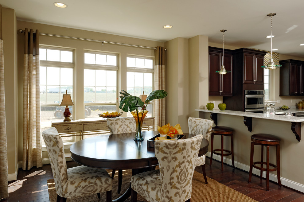 Photo of a large transitional kitchen/dining combo in DC Metro with beige walls and dark hardwood floors.