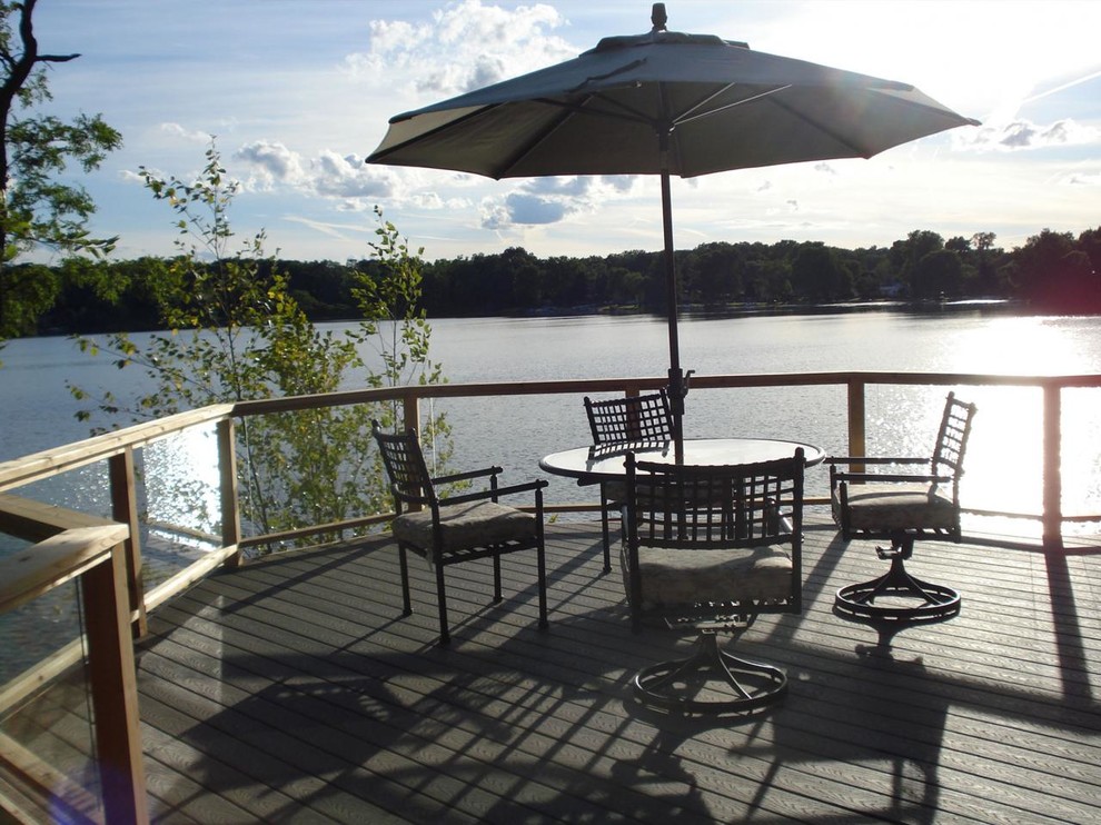 Large mountain style backyard balcony deck photo in Detroit with no cover