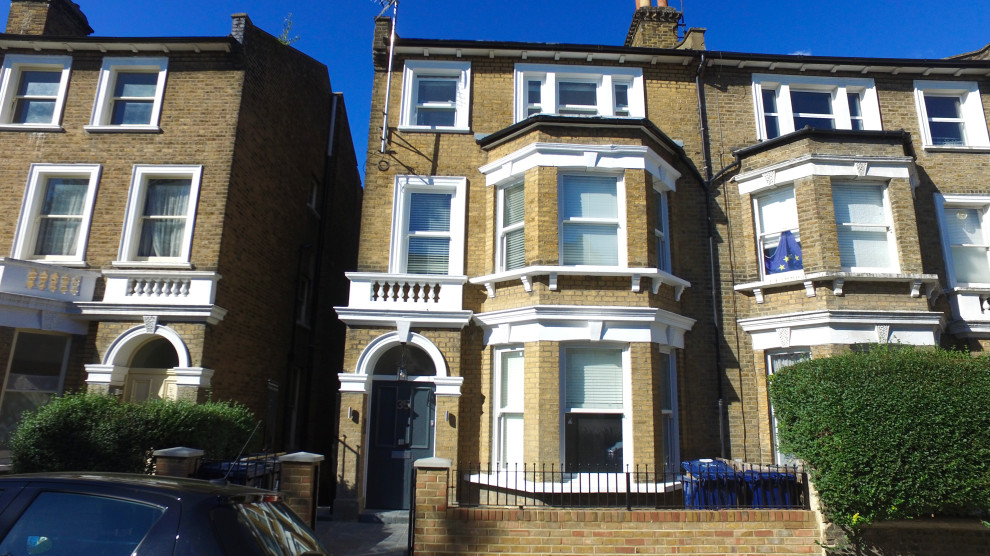 Inspiration for a large traditional duplex exterior in London with four or more storeys.
