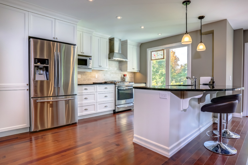 Example of a transitional kitchen design in Toronto