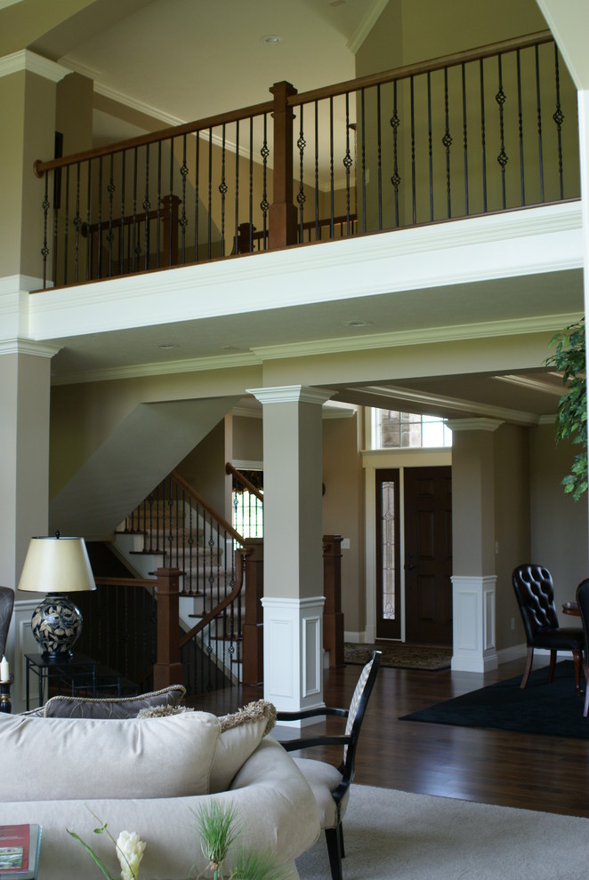 Inspiration for a mid-sized traditional hallway in Other with beige walls and dark hardwood floors.