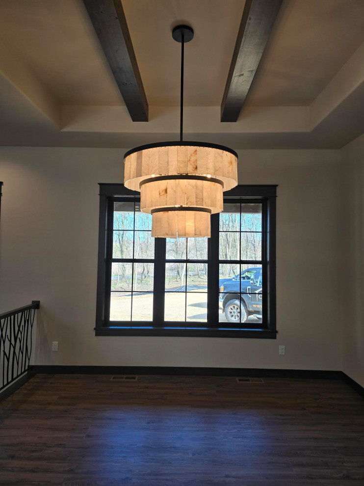 Inspiration for a small transitional vinyl floor, brown floor and exposed beam dining room remodel