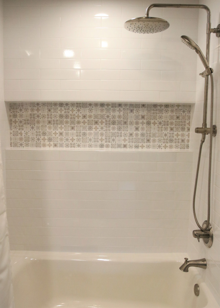 Inspiration for a mid-sized transitional master white tile and ceramic tile porcelain tile, gray floor and single-sink alcove bathtub remodel with shaker cabinets, dark wood cabinets, a one-piece toilet, beige walls, a drop-in sink, laminate countertops, white countertops, a niche and a built-in vanity