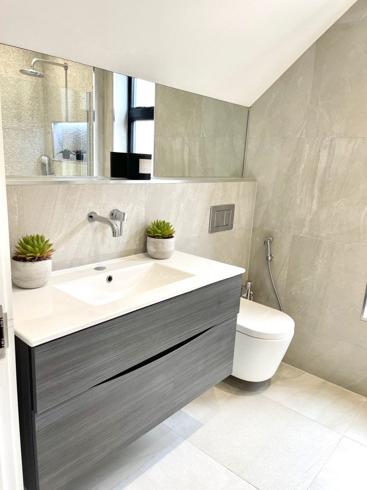 This is an example of a medium sized contemporary ensuite bathroom in London with flat-panel cabinets, black cabinets, a walk-in shower, a wall mounted toilet, porcelain tiles, grey floors, an open shower, a wall niche, a single sink and a floating vanity unit.