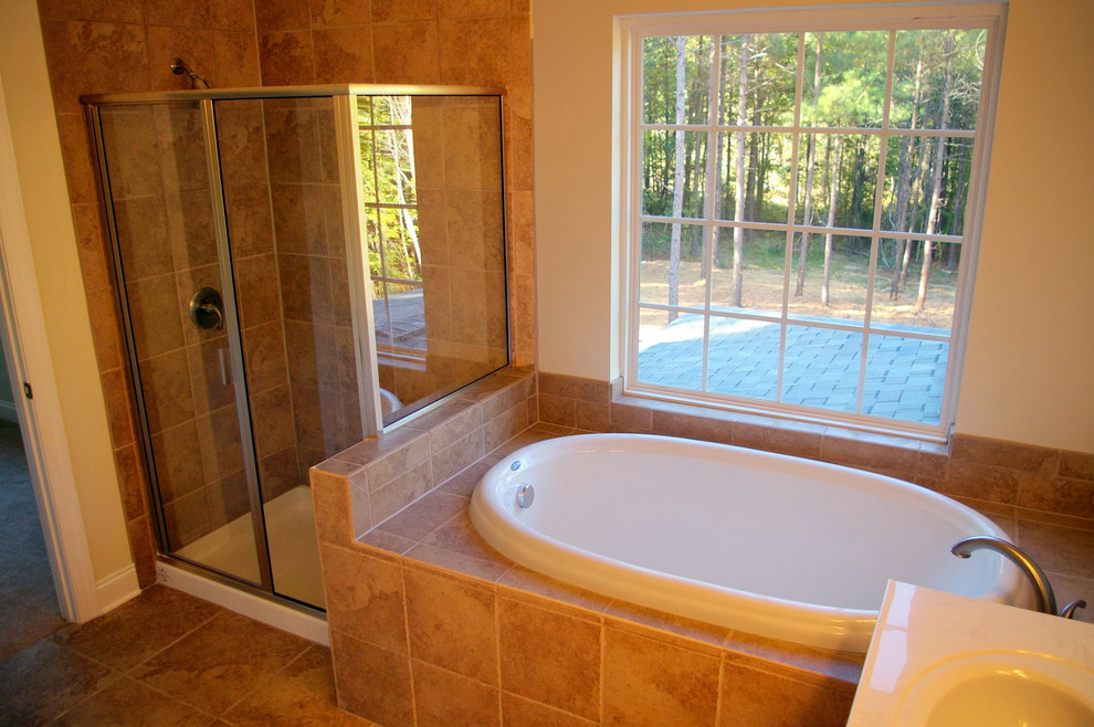 Mid-sized traditional master bathroom in Raleigh with a corner tub, a corner shower, a one-piece toilet, beige tile, ceramic tile, beige walls and ceramic floors.