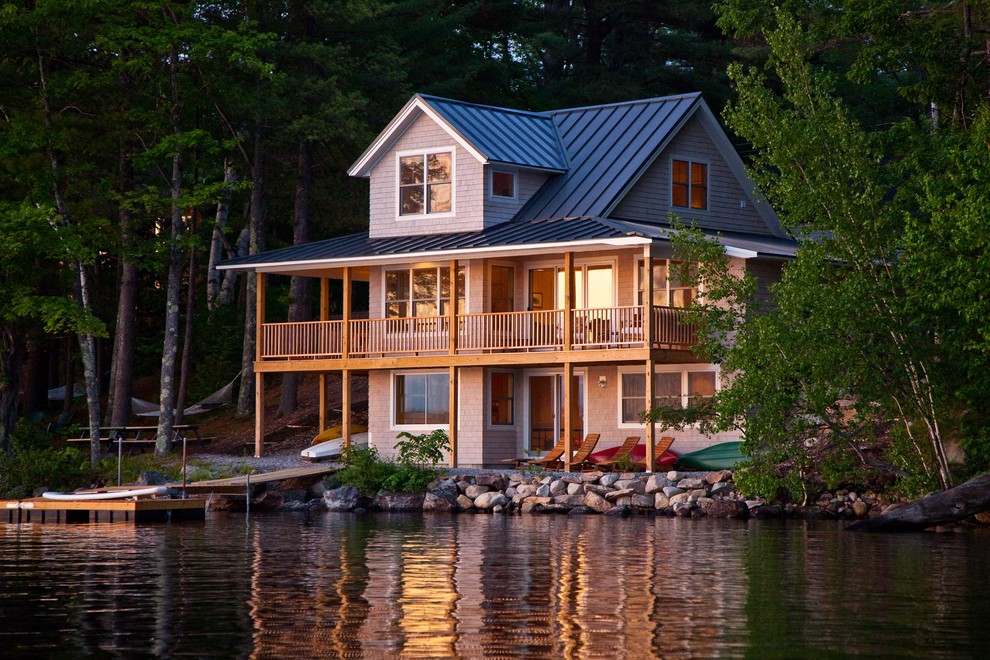 This is an example of a mid-sized country three-storey exterior in Portland Maine with wood siding.