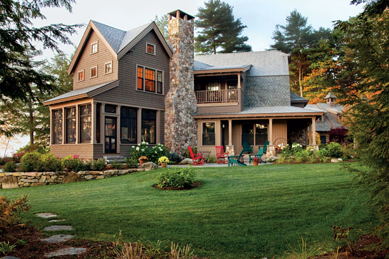 Photo of an expansive country three-storey brown exterior in Boston with wood siding.