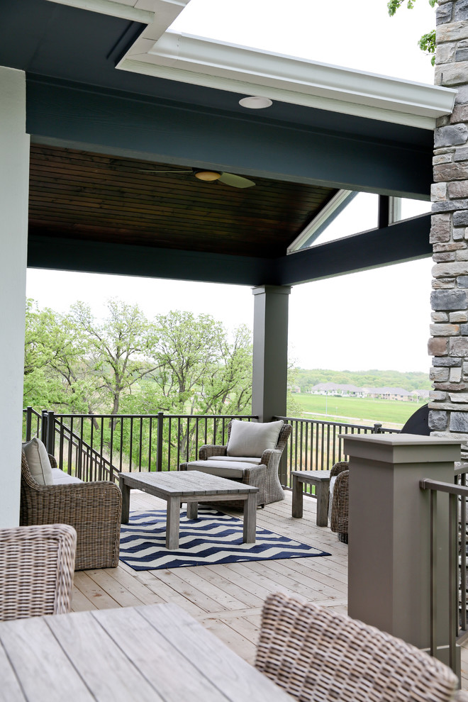 Transitional two-story blue home design photo