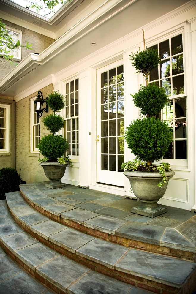 Photo of a traditional backyard garden in Atlanta with natural stone pavers.