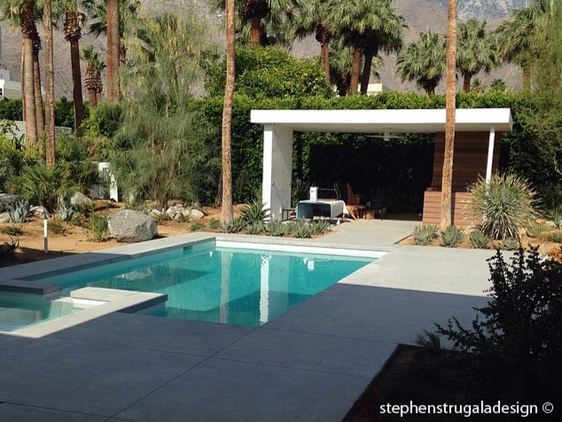 Minimalist concrete and custom-shaped pool photo in Los Angeles