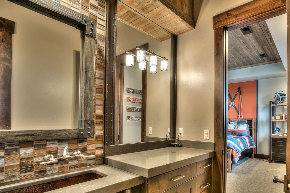 Inspiration for a mid-sized country 3/4 bathroom in Denver with shaker cabinets, dark wood cabinets, an alcove shower, a two-piece toilet, multi-coloured tile, matchstick tile, beige walls, slate floors, an undermount sink and solid surface benchtops.