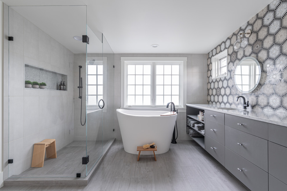 Design ideas for a contemporary master bathroom in Seattle with a hinged shower door, flat-panel cabinets, grey cabinets, a japanese tub, an alcove shower, wood-look tile, an undermount sink, marble benchtops, grey floor, grey benchtops, a single vanity, a floating vanity and wallpaper.