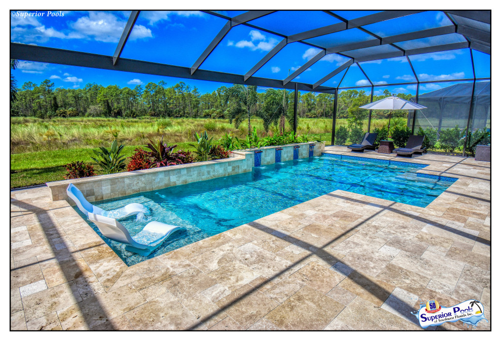 Inspiration for a mid-sized contemporary backyard rectangular pool in Tampa with with a pool and natural stone pavers.