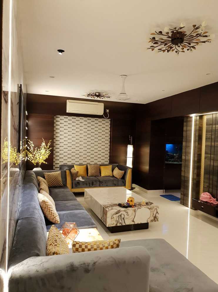 На фото: гостиная комната в современном стиле с мраморным полом, бежевым полом и панелями на части стены