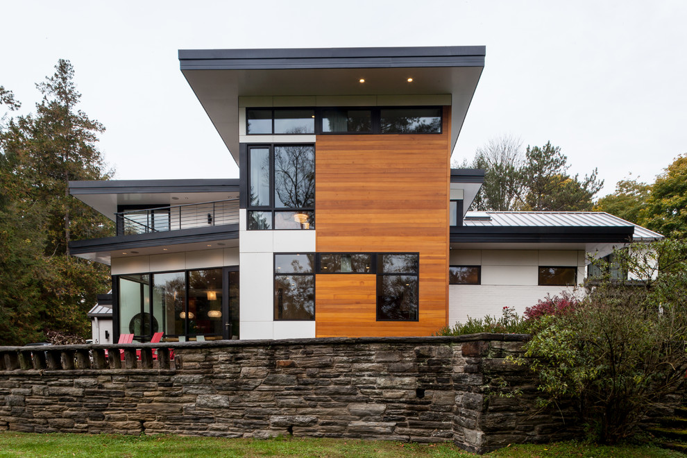 This is an example of a contemporary exterior in Other with wood siding.