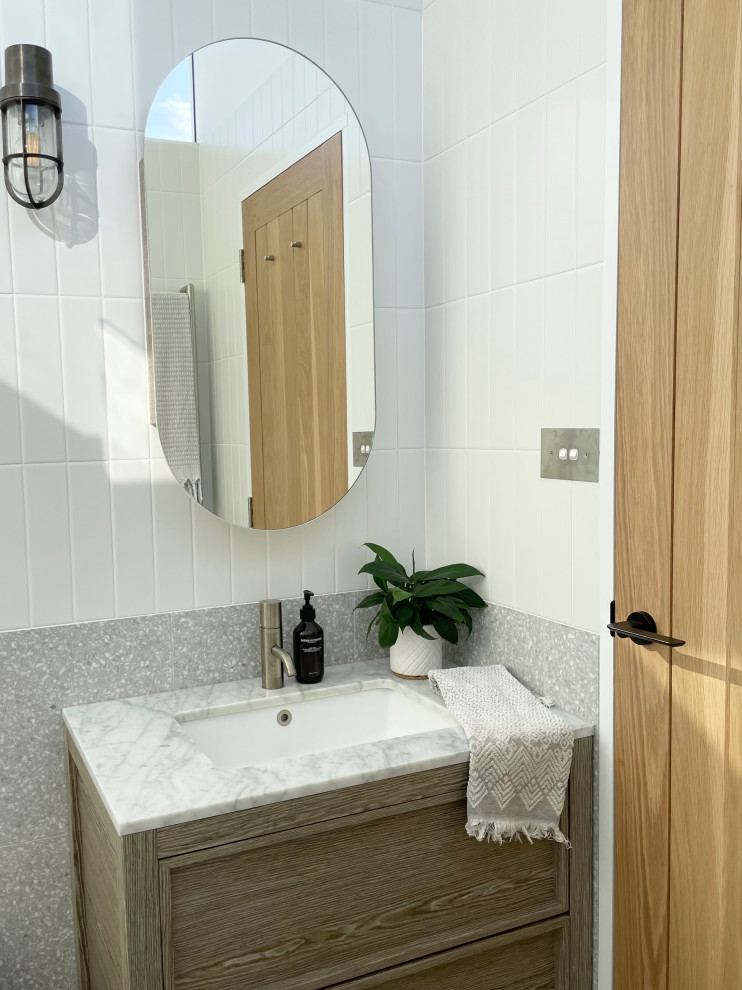 Inspiration for a small contemporary master bathroom in Sydney with beaded inset cabinets, a double shower, a one-piece toilet, white tile, ceramic tile, terrazzo floors, an undermount sink, marble benchtops, grey floor, an open shower, grey benchtops, a niche, a single vanity and a freestanding vanity.