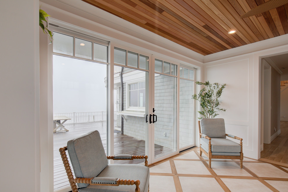 Idee per una veranda costiera di medie dimensioni con pavimento in gres porcellanato e pavimento beige