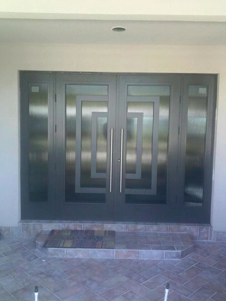 Mid-sized front door photo in Miami with a black front door