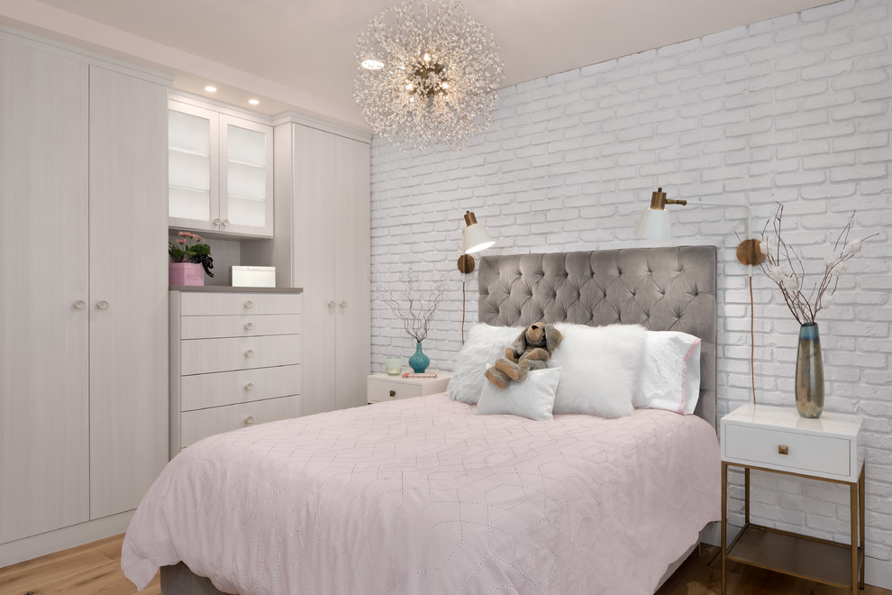 Inspiration for a small contemporary kids' room for girls in Seattle with pink walls, light hardwood floors and brown floor.