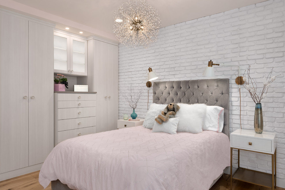 Precious Place - It was time for a new style for this teenager’s bedroom.  She desperately needed more room for clothes while dreaming of a grown-up room with drapes and a velvet bed.  Too busy with teen life to focus on working with a designer, her mother offered the general guidelines.  Design a room that will transition into young adulthood with furnishings that will be transferable to her apartment in the future.  Two must haves:  the color “millennial pink” and a hardwood floor!
This dark walk-out basement-bedroom was transformed into a bright, efficient, grown-up room so inviting that it earned the name “precious”!
Clarity Northwest Photography: Matthew Gallant