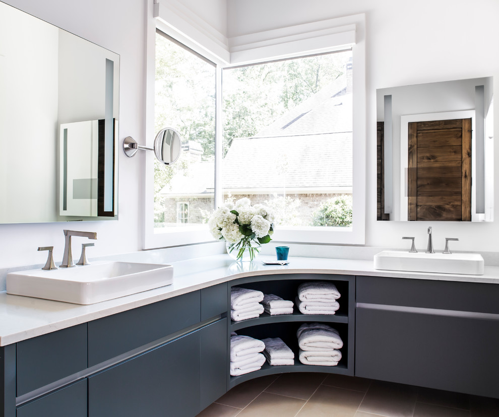 Photo of a mid-sized country master bathroom in Atlanta with flat-panel cabinets, grey cabinets, white walls, porcelain floors, a vessel sink, engineered quartz benchtops, white benchtops and beige floor.