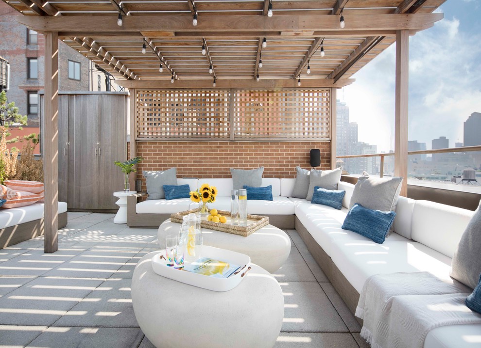 Design ideas for a contemporary rooftop and rooftop deck in New York with a pergola.