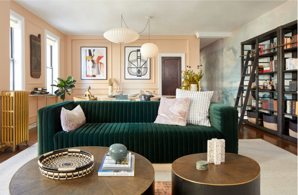 Midcentury living room in New York with medium hardwood floors and wallpaper.