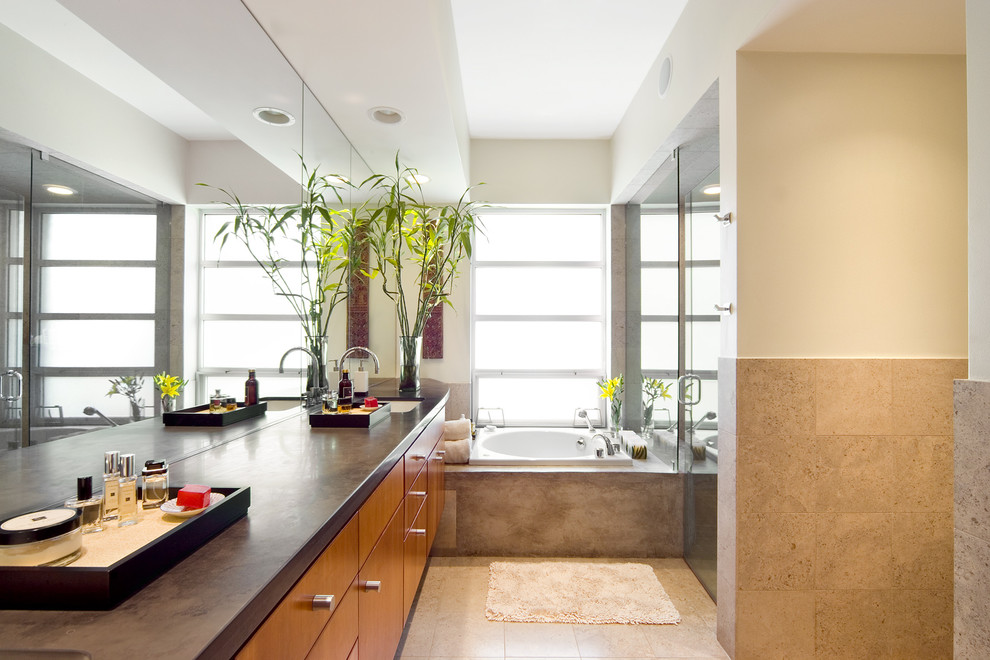 Inspiration for a modern bathroom in Dallas with an undermount sink, flat-panel cabinets, medium wood cabinets, a drop-in tub, an alcove shower and brown tile.