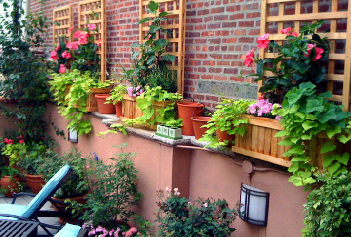This is an example of a traditional rooftop deck in New York with a container garden.