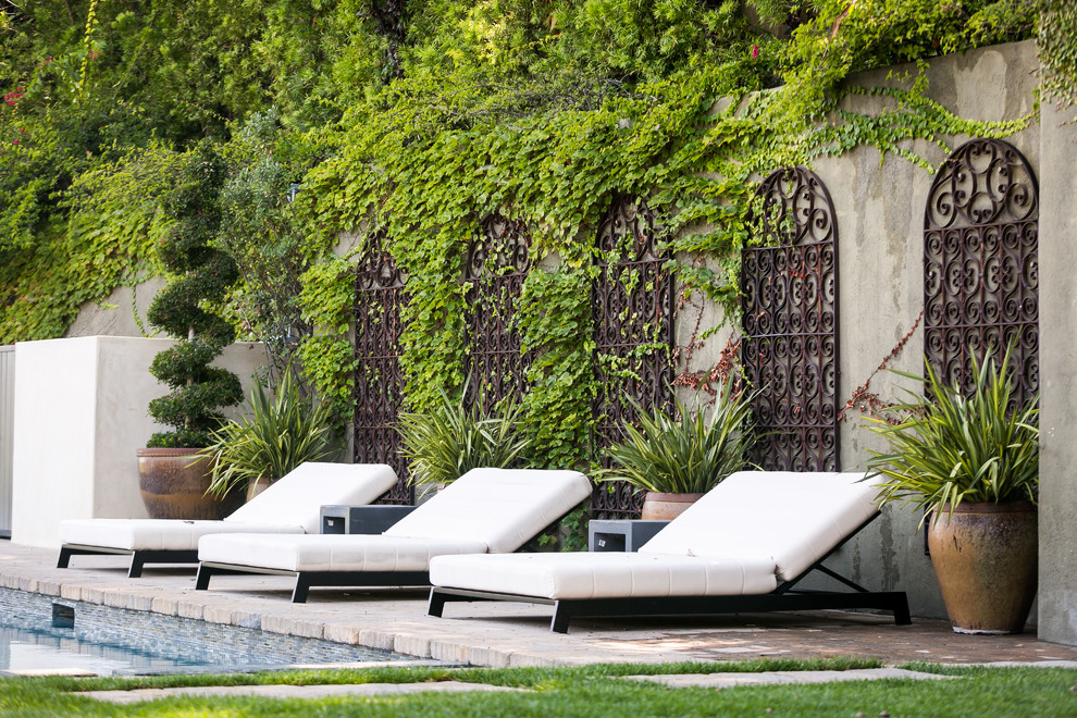 Inspiration for a mediterranean backyard rectangular lap pool in Los Angeles.