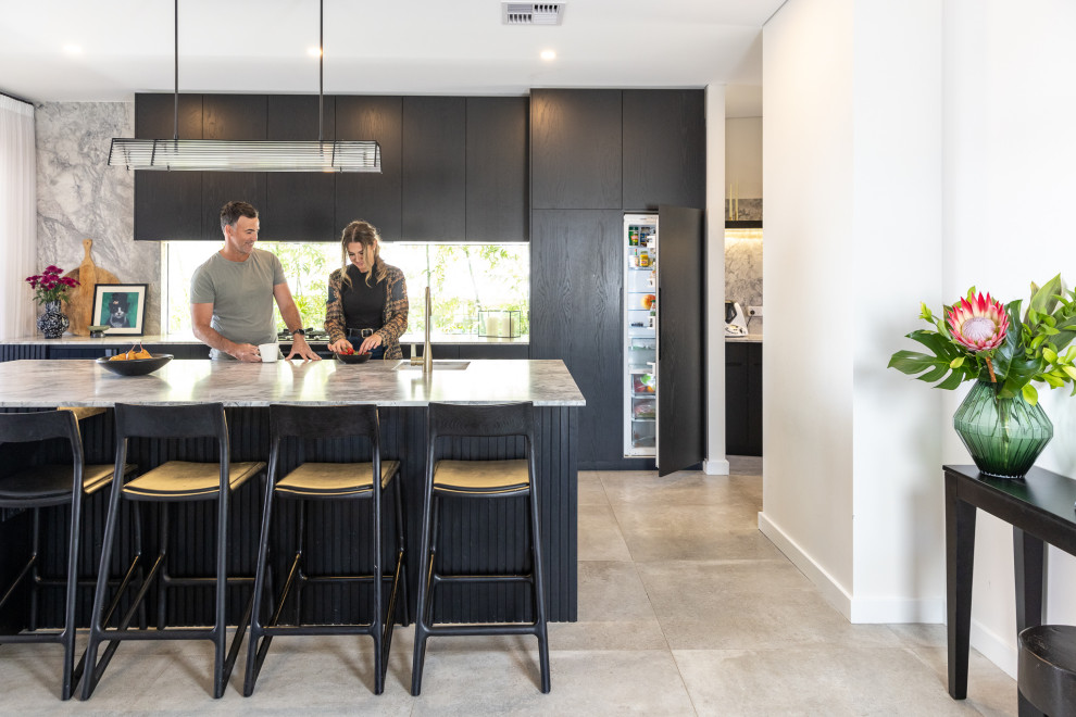 Photo of a large contemporary galley kitchen/diner in Perth with a submerged sink, marble worktops, multi-coloured splashback, marble splashback, coloured appliances, porcelain flooring, an island, grey floors, multicoloured worktops and black cabinets.