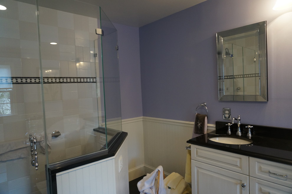 Example of a mid-sized classic white tile and ceramic tile ceramic tile bathroom design in Philadelphia with an undermount sink, raised-panel cabinets, white cabinets and purple walls