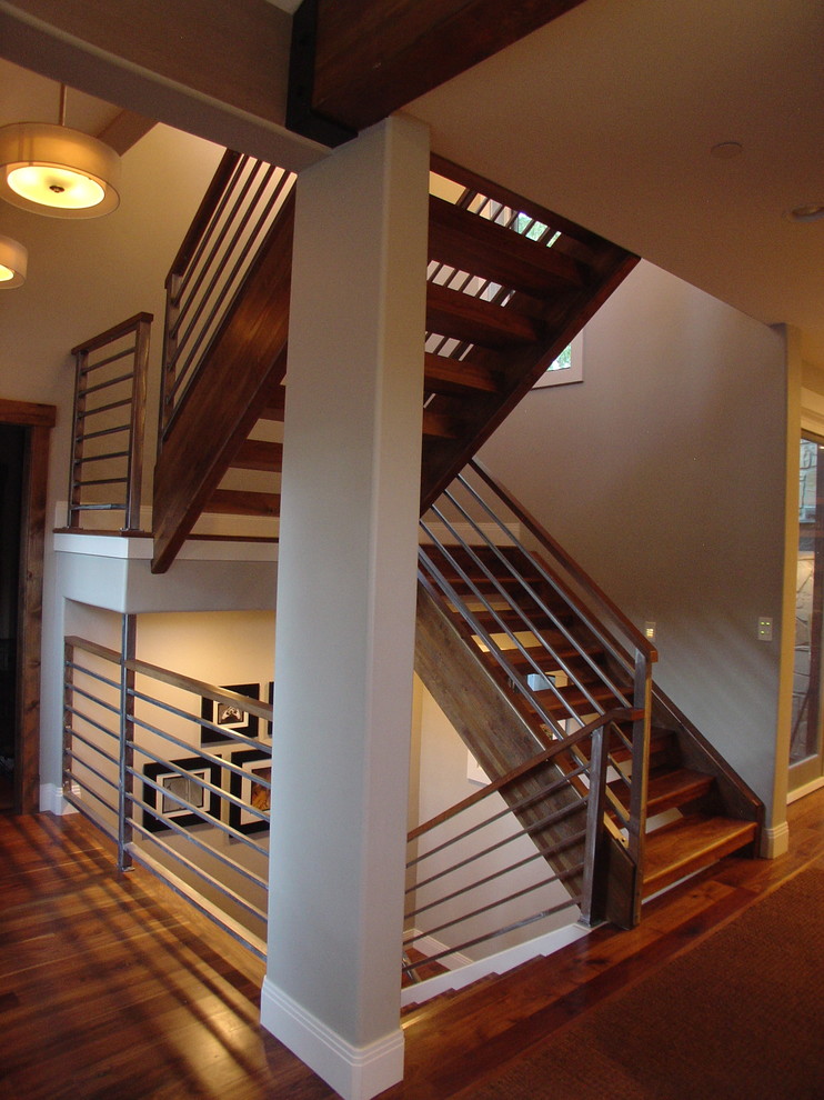 Inspiration for a large contemporary wood u-shaped staircase in Salt Lake City with open risers and metal railing.