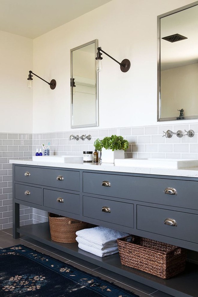 Inspiration for a large industrial master gray tile and ceramic tile ceramic tile bathroom remodel in Dallas with a drop-in sink, shaker cabinets, gray cabinets, quartz countertops, a two-piece toilet and white walls