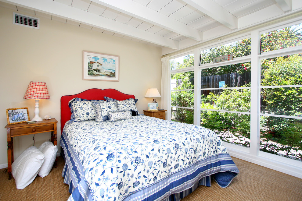 This is an example of a traditional bedroom in San Diego with beige walls.