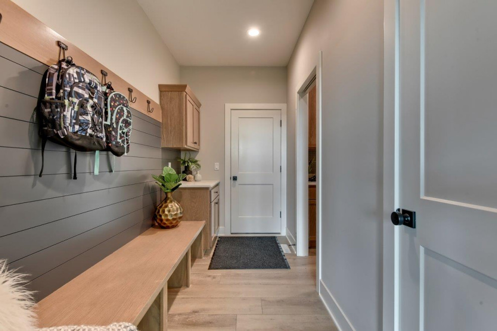 Transitional mudroom photo with gray walls