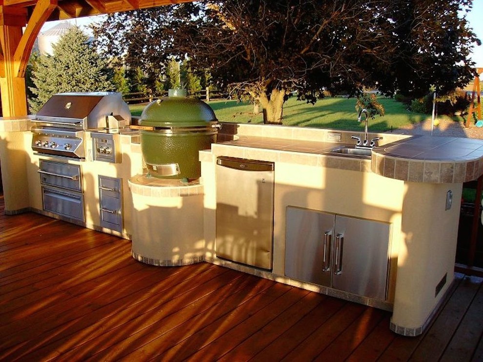 Mid-sized transitional backyard patio kitchen photo with a pergola