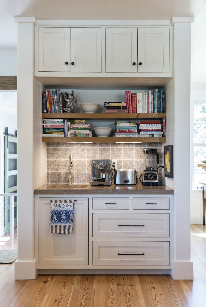 Inspiration for a transitional kitchen in Louisville with an undermount sink, distressed cabinets, concrete benchtops, multi-coloured splashback, ceramic splashback and medium hardwood floors.