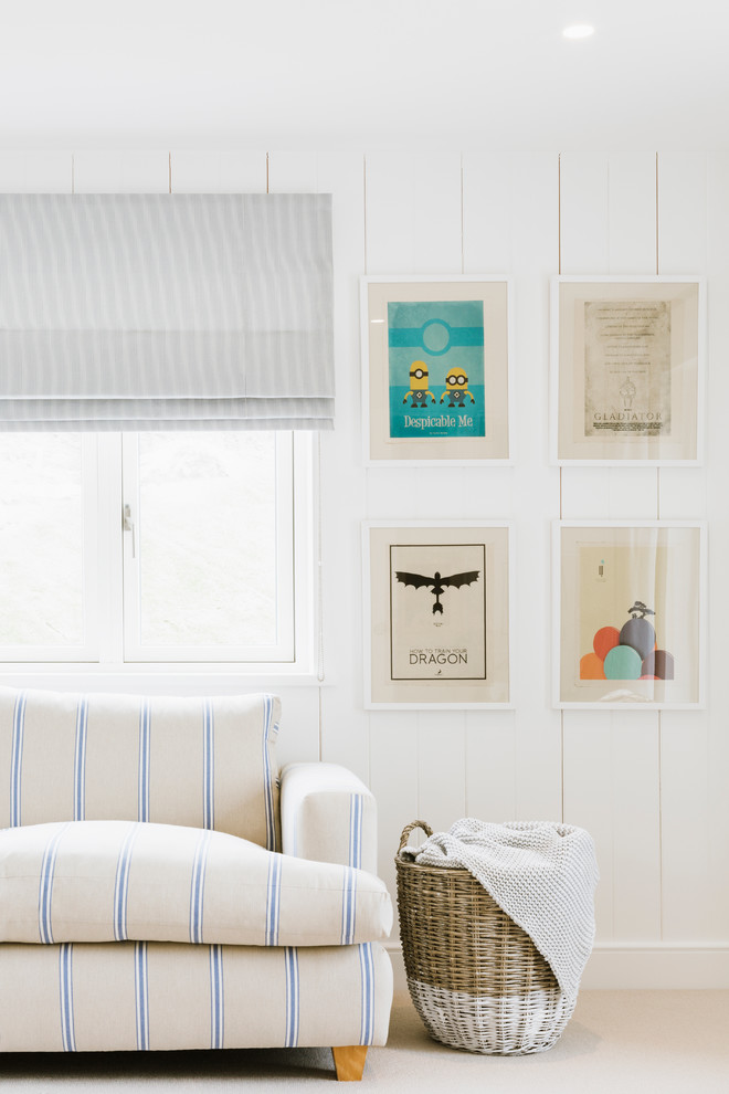 Design ideas for a beach style family room in Hampshire with white walls and carpet.