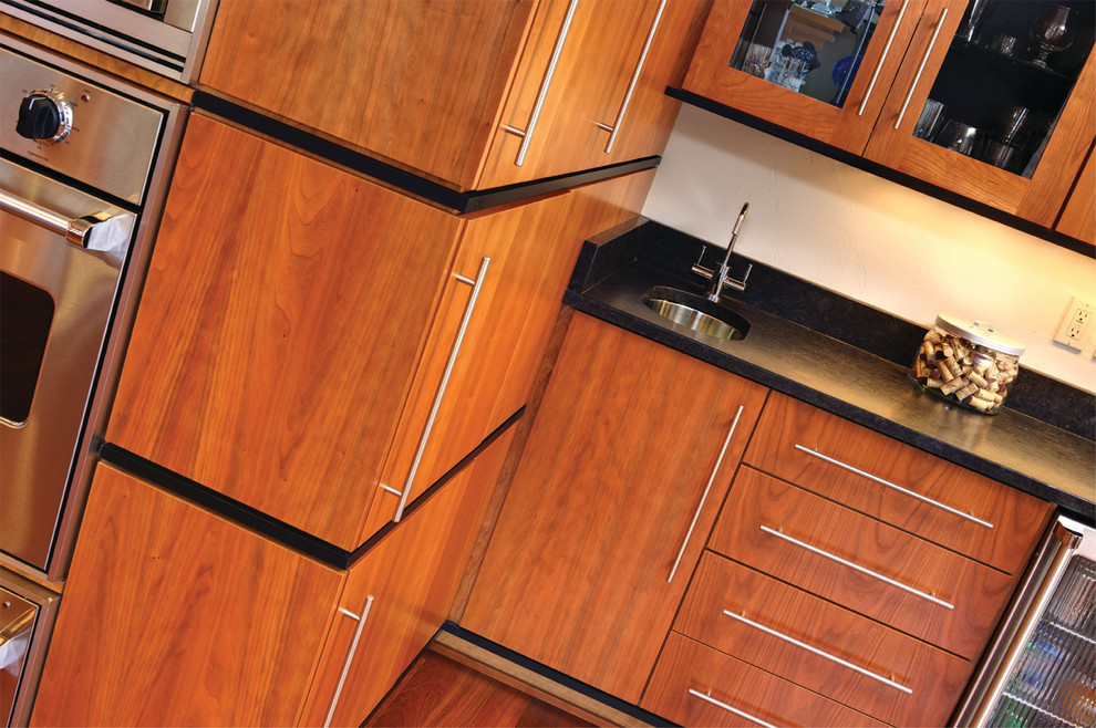 Inspiration for a large transitional l-shaped eat-in kitchen remodel with shaker cabinets, light wood cabinets, granite countertops, stainless steel appliances and an island