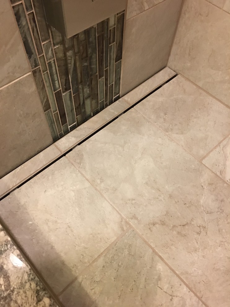 Mid-sized transitional bathroom in Other with an alcove shower, beige tile, ceramic tile, beige walls, ceramic floors, blue floor and a hinged shower door.