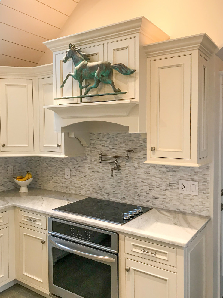 Eat-in kitchen - small transitional u-shaped vaulted ceiling eat-in kitchen idea with beaded inset cabinets, white cabinets, paneled appliances and no island