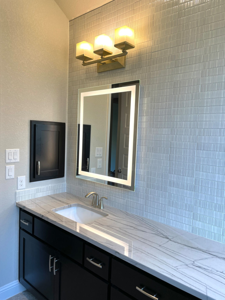 Medium sized contemporary ensuite bathroom in Austin with recessed-panel cabinets, black cabinets, multi-coloured tiles, porcelain tiles, a submerged sink, engineered stone worktops, multi-coloured worktops, double sinks and a built in vanity unit.