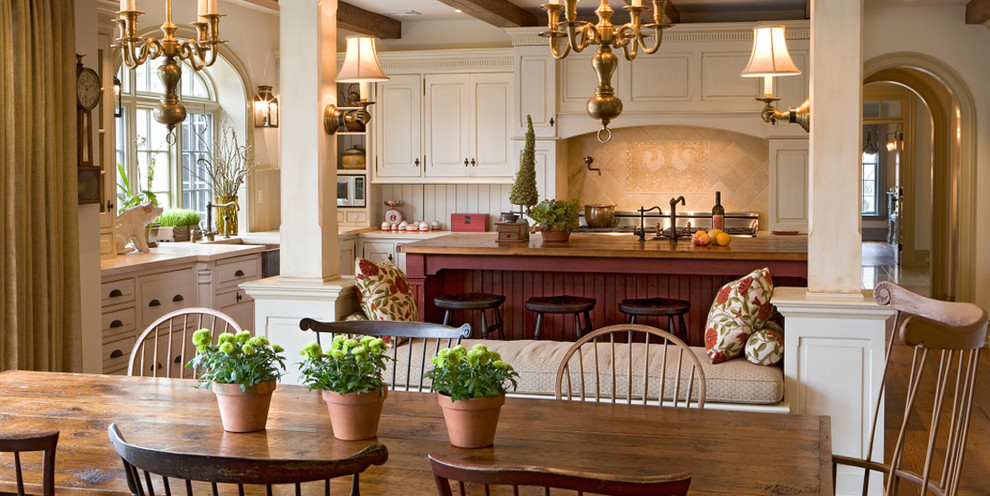 Design ideas for a country eat-in kitchen in Philadelphia with raised-panel cabinets and white cabinets.