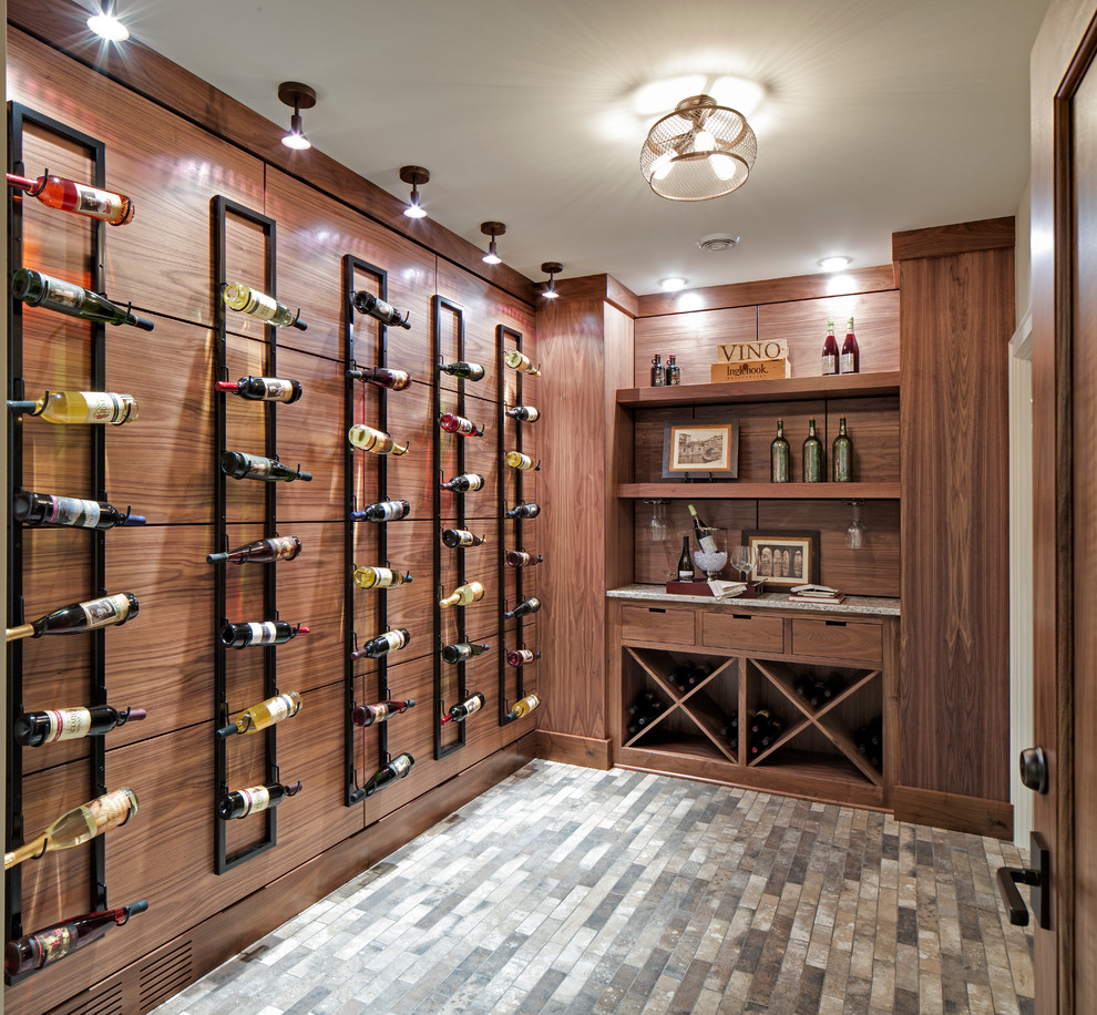 Inspiration for a mid-sized transitional wine cellar in Minneapolis with storage racks and grey floor.
