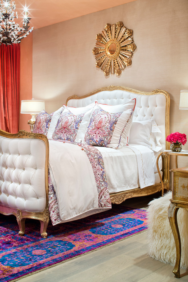 This is an example of a mediterranean bedroom in Houston with beige walls and medium hardwood floors.