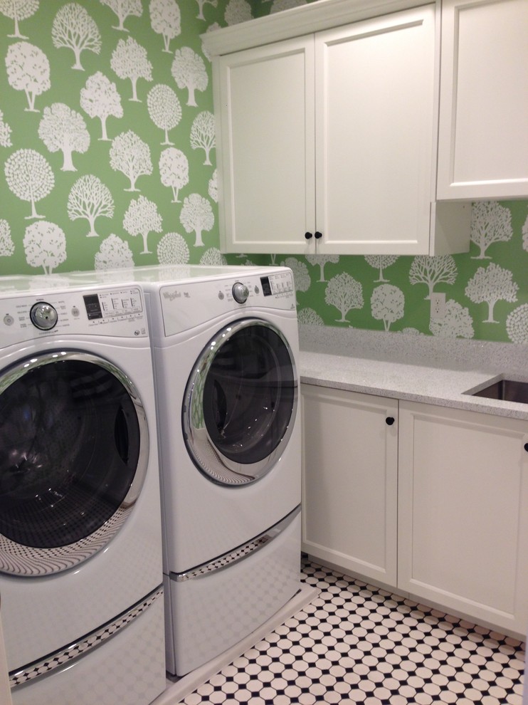 Inspiration for a large country l-shaped dedicated laundry room in Salt Lake City with an undermount sink, recessed-panel cabinets, white cabinets, quartz benchtops, green walls, porcelain floors and a side-by-side washer and dryer.