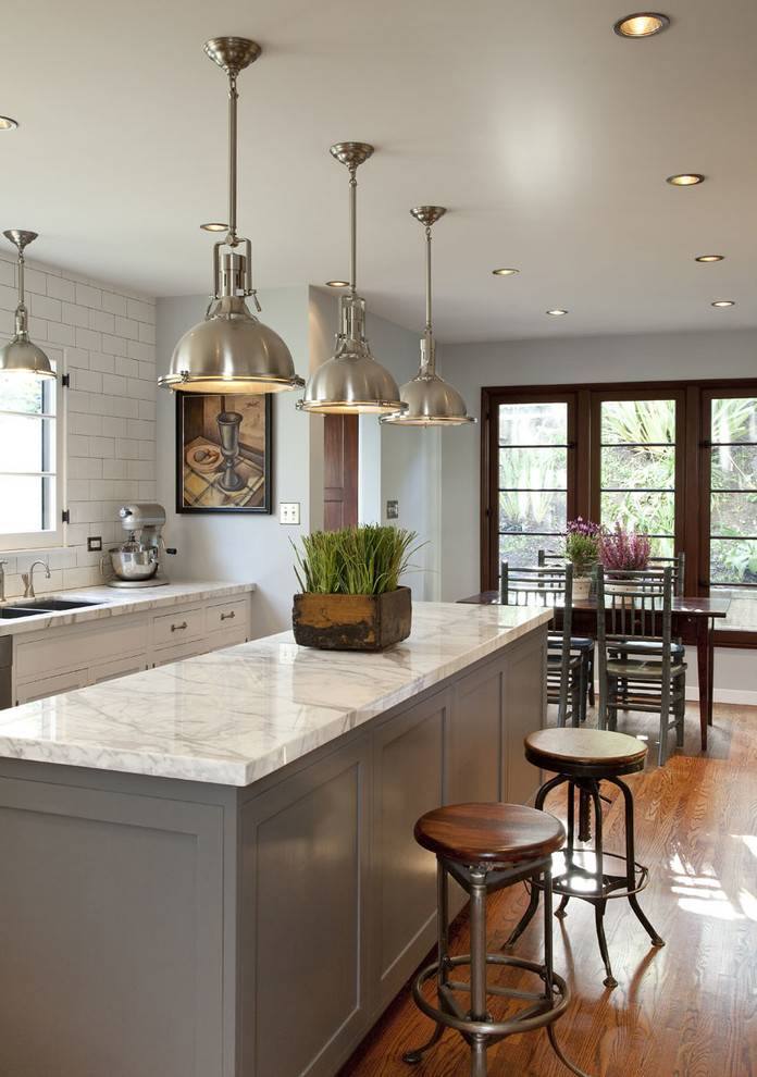 Inspiration for a traditional eat-in kitchen in Los Angeles with grey cabinets and marble benchtops.